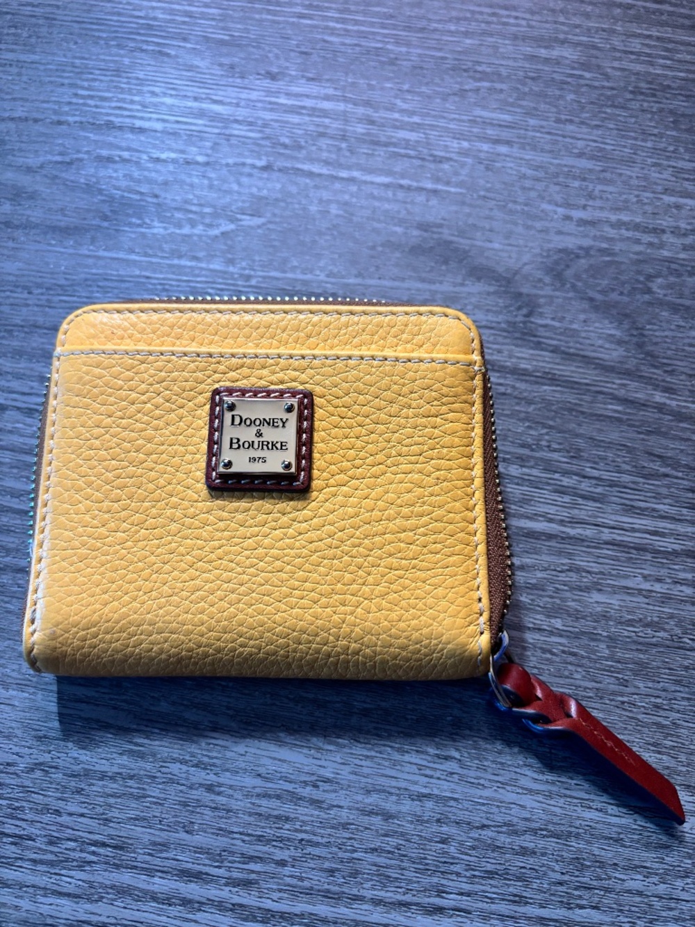 Dooney and Bourke yellow pebble zip wallet